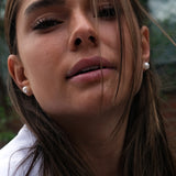 14kt Gold Maxi Studs - 8-9mm white round freshwater pearl earrings in 14kt yellow gold by Nishi Pearls, worn on a model