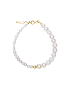 Alaia Bracelet - white freshwater pearl bracelet in yellow gold plated silver, 6.75-7.5in by Nishi Pearls, studio view