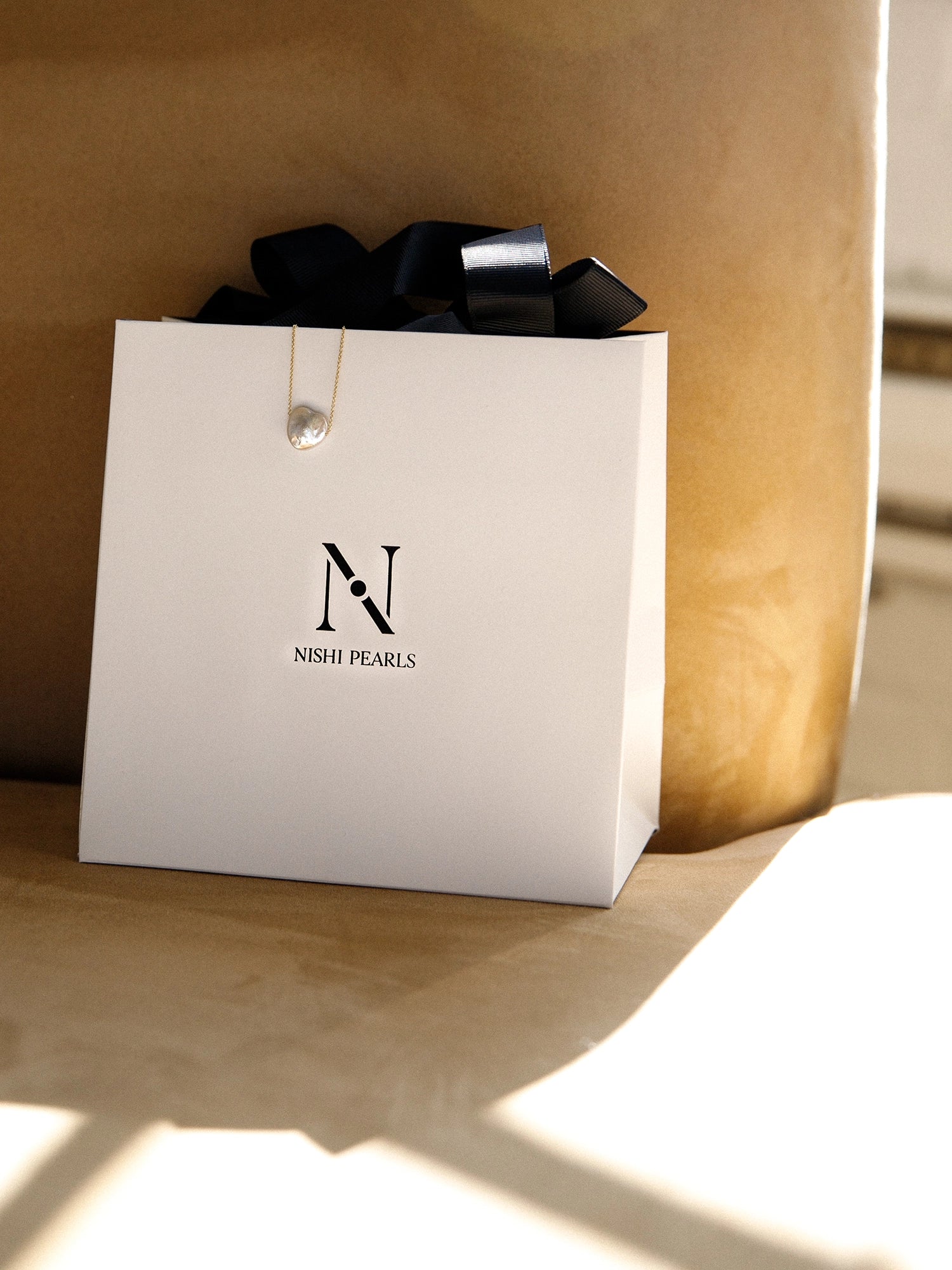 Amore Necklace - 13-14mm white baroque freshwater pearls in 14kt yellow gold by Nishi Pearls, in Nishi Pearls gift packaging