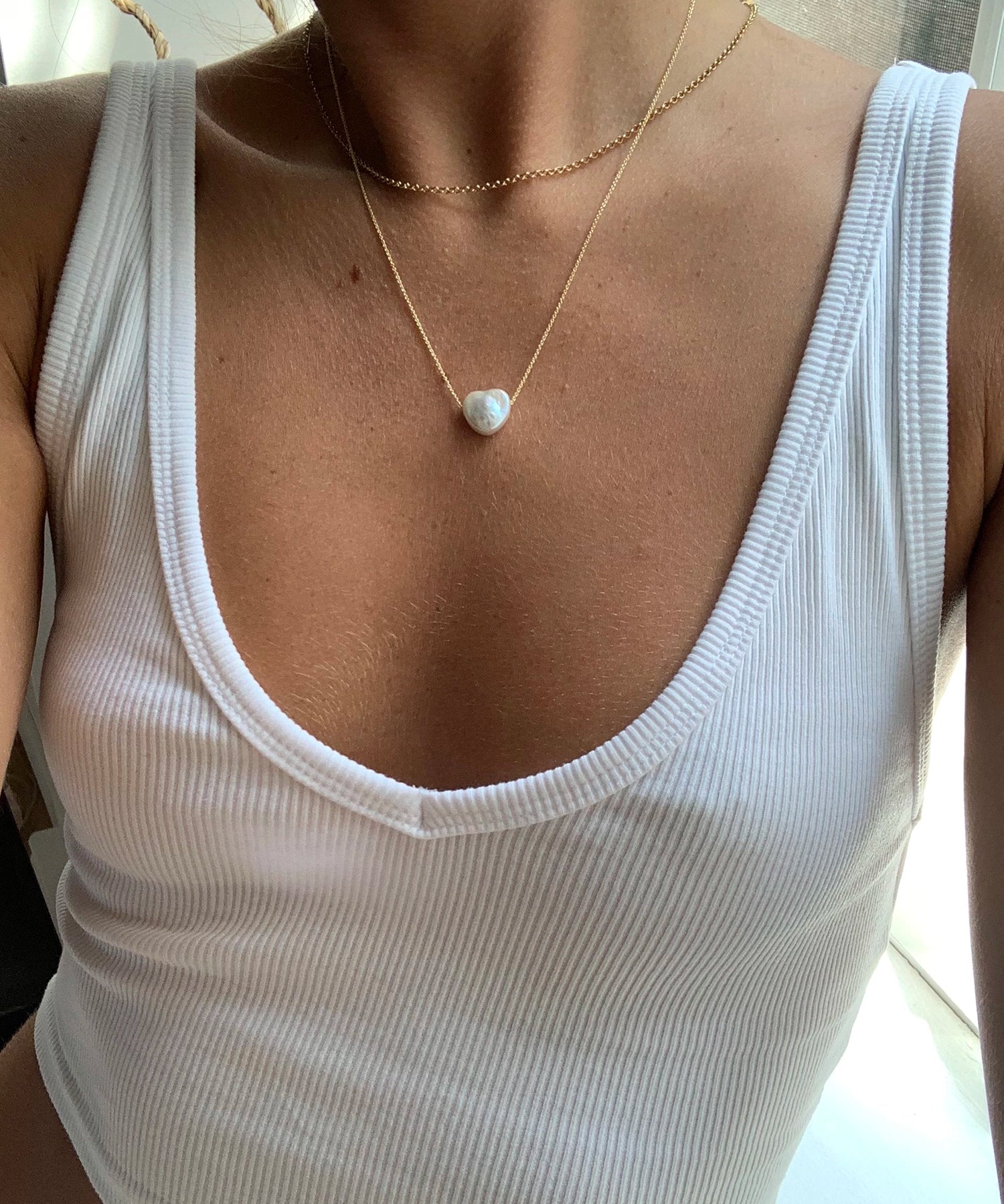 Amore Necklace - 13-14mm white baroque freshwater pearls in 14kt yellow gold, 16-18in by Nishi Pearls, worn on a model