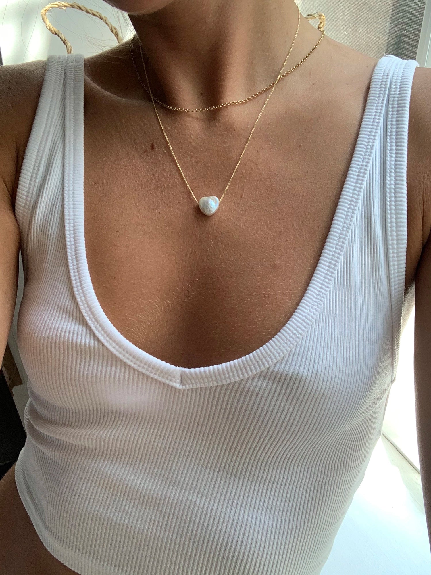 Amore Necklace - 13-14mm white baroque freshwater pearls in 14kt yellow gold, 16-18in by Nishi Pearls, worn on a model
