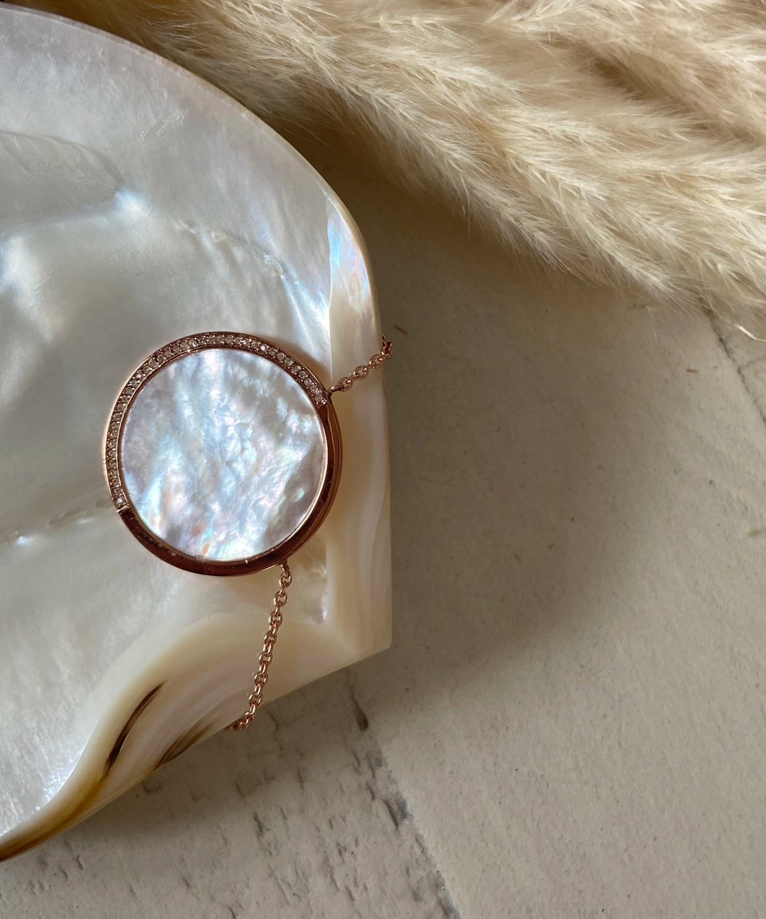 Amulet Necklace - white mother-of-pearl, rose gold vermeil, cubic zirconia, 18in by Nishi Pearls, styled lifestyle photo
