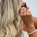 Asymmetrical Opened Ring - mixed-size white freshwater pearl ring in yellow gold vermeil, on a model by Nishi Pearls, angle