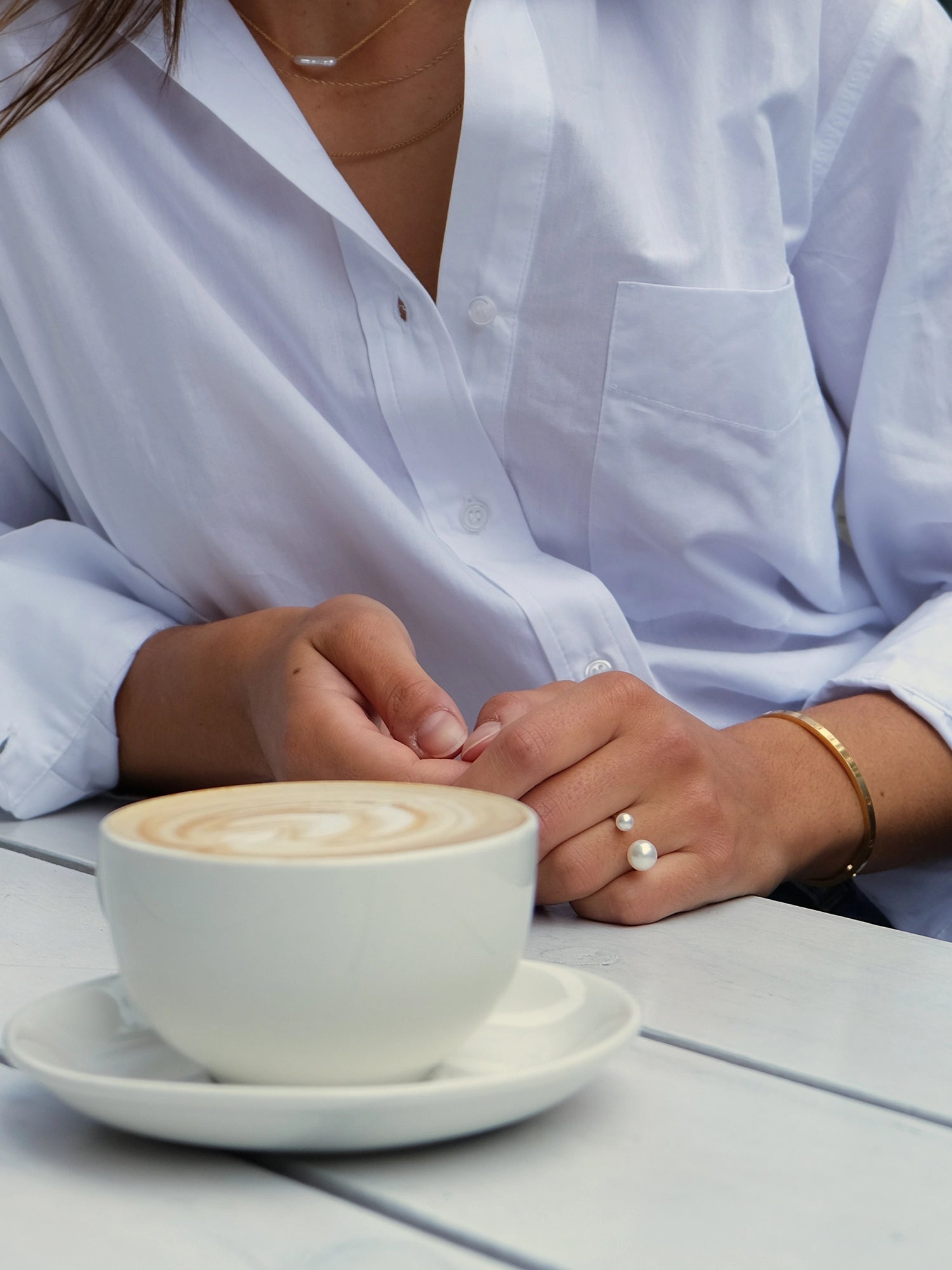 Asymmetrical Opened Ring - mixed-size white freshwater pearl ring in yellow gold vermeil by Nishi Pearls, on a model, angle