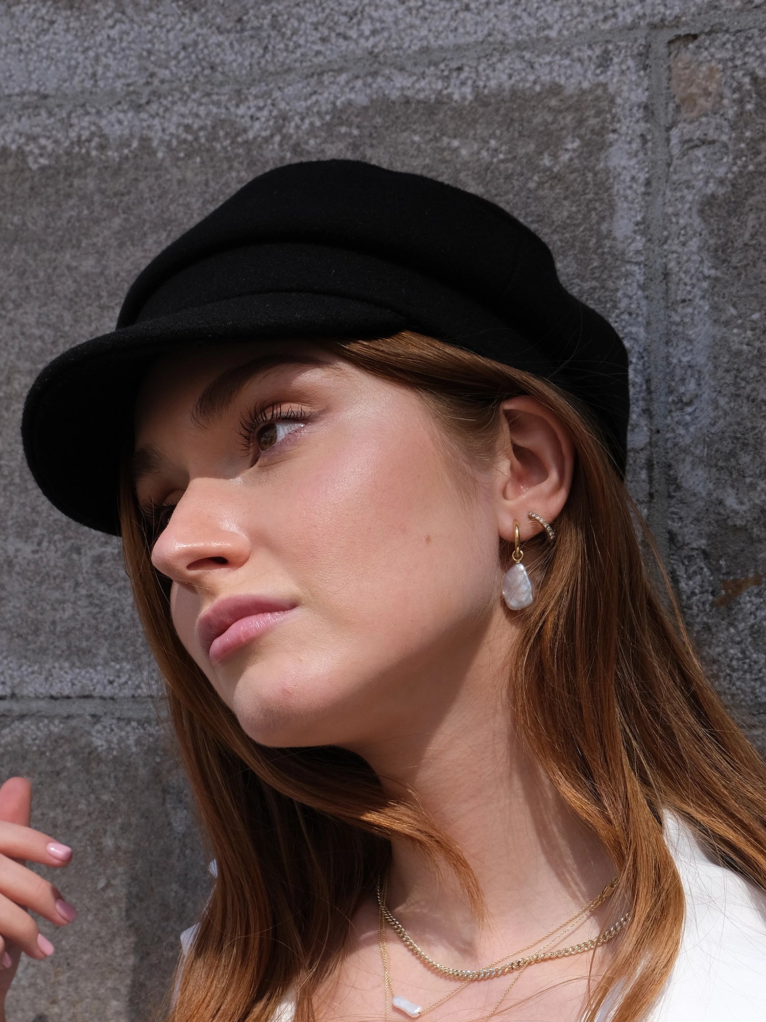 Azalea Hoops - mixed-size white baroque pearls in gold vermeil by Nishi Pearls, worn on a model, alternate angle