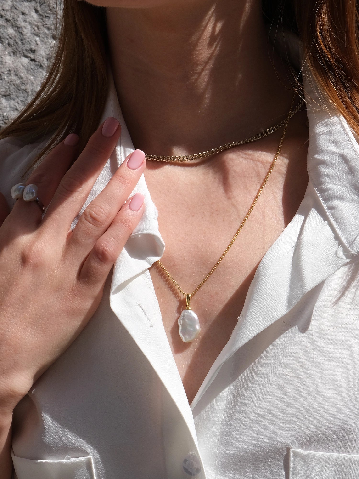 Azalea Necklace - mixed-size white baroque freshwater pearls in gold vermeil, 18-20in by Nishi Pearls, styled on a model