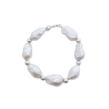 Baroque Bead Bracelet - mixed-size white baroque freshwater pearls in sterling silver, 7.5in by Nishi Pearls, studio view
