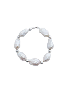 Baroque Bead Bracelet - mixed-size white baroque freshwater pearls in sterling silver, 7.5in by Nishi Pearls, studio view
