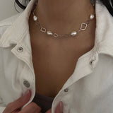 Baroque Link Necklace - 10-11mm white baroque freshwater pearls in sterling silver, 18in by Nishi Pearls, worn on a model
