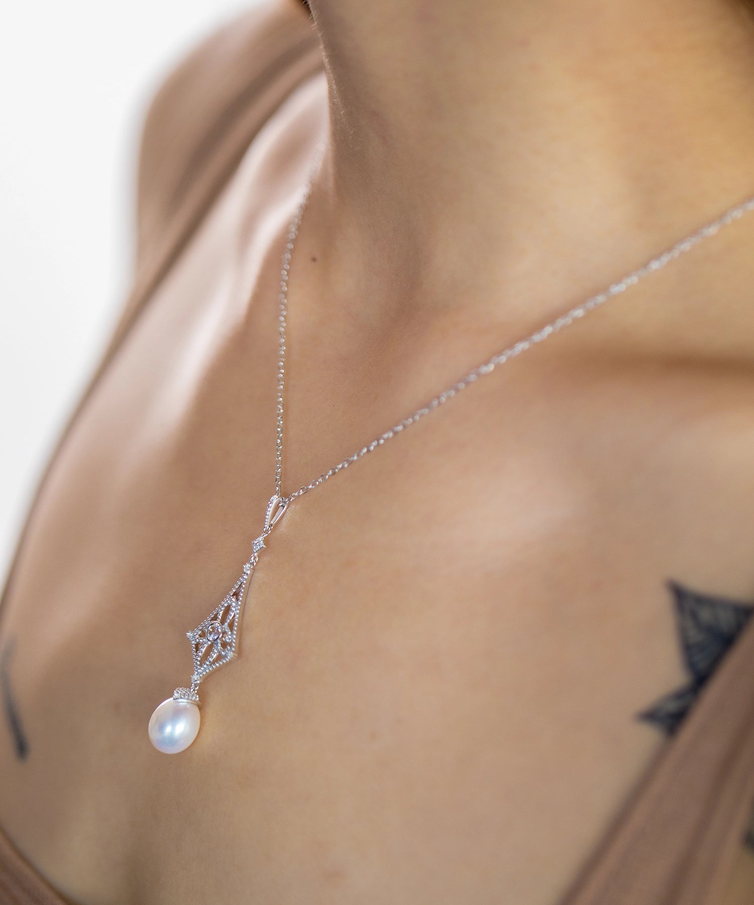 Beaded Drop Necklace - 8-9mm white freshwater pearls in sterling silver, 16.5-18in by Nishi Pearls, studio alternate angle