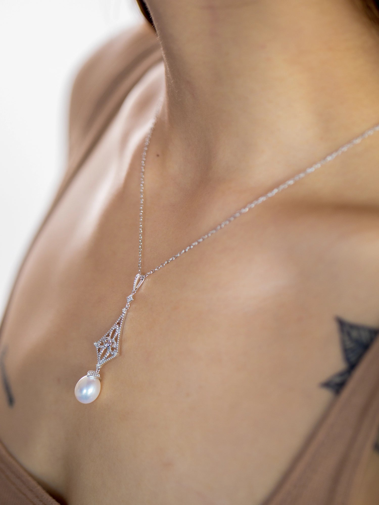 Beaded Drop Necklace - 8-9mm white freshwater pearls in sterling silver, 16.5-18in by Nishi Pearls, studio alternate angle