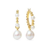 Beatrice Hoops - mixed-size white baroque freshwater pearl earrings in yellow gold vermeil by Nishi Pearls, studio view