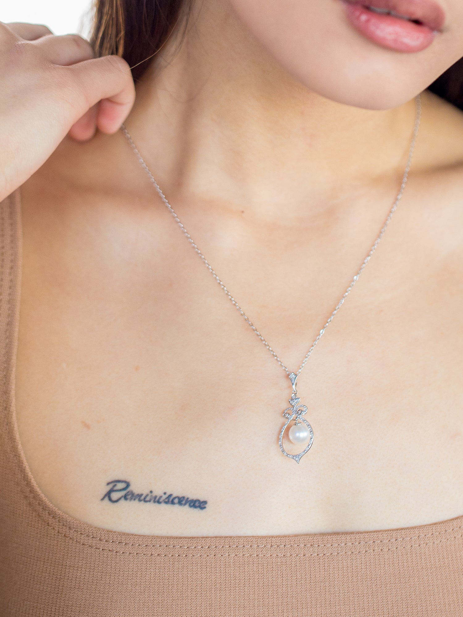 Bell Necklace - 8-9mm white freshwater pearls in sterling silver with topaz, 16.5-18in by Nishi Pearls, styled on a model