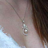 Bell Necklace - 8-9mm white freshwater pearls in sterling silver with topaz, 16.5-18in by Nishi Pearls, worn on a model