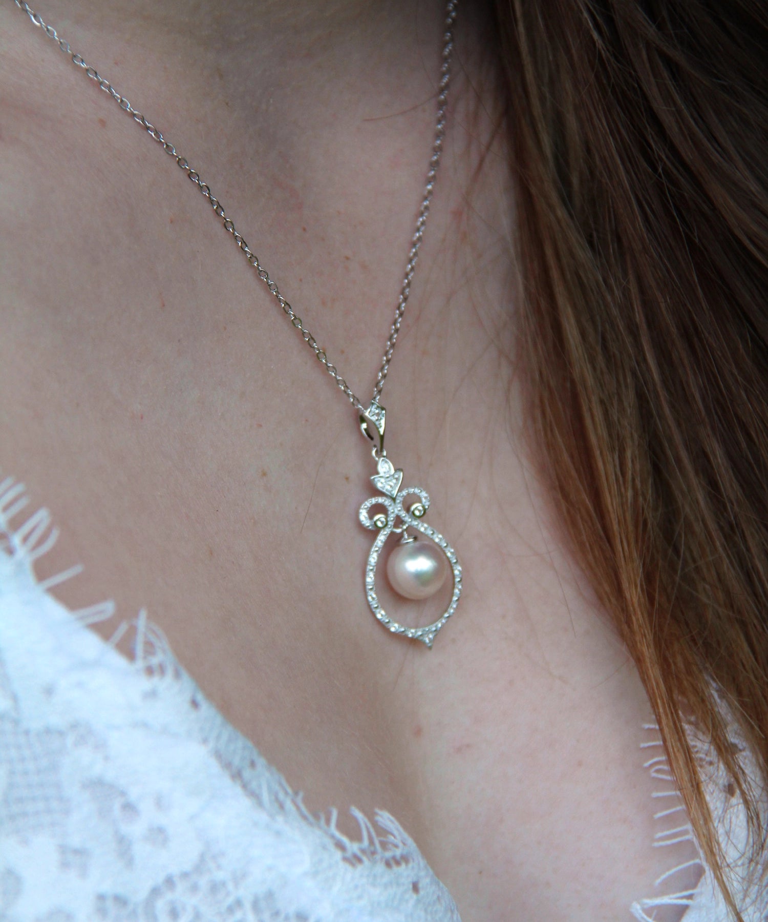 Bell Necklace - 8-9mm white freshwater pearls in sterling silver with topaz, 16.5-18in by Nishi Pearls, worn on a model