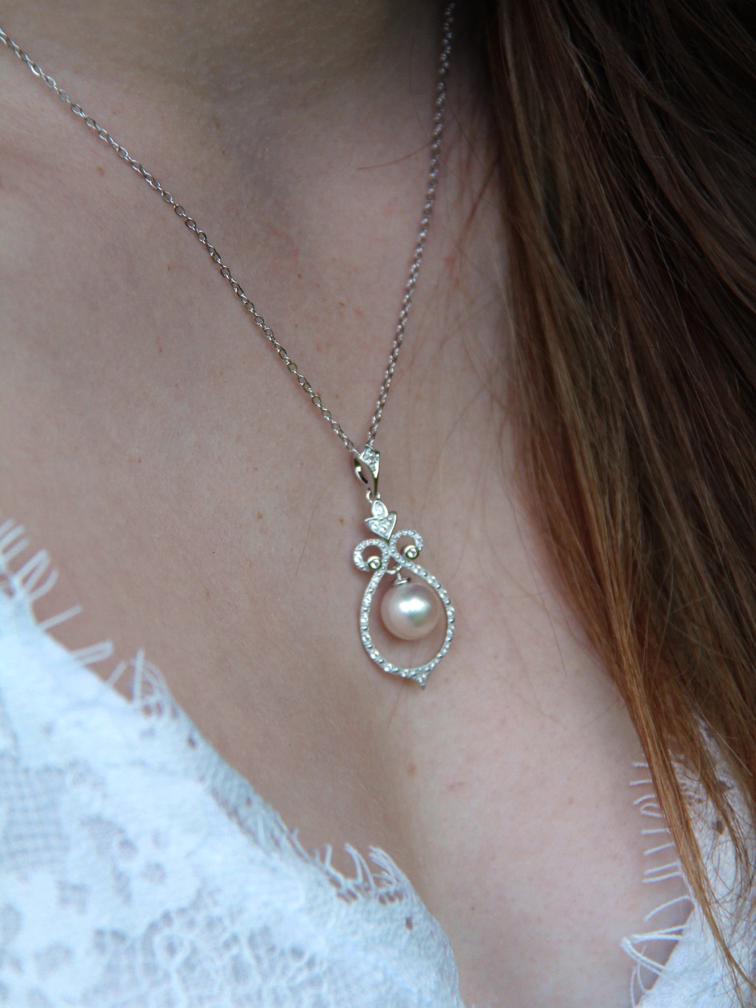 Bell Necklace - 8-9mm white freshwater pearls in sterling silver with topaz, 16.5-18in by Nishi Pearls, worn on a model