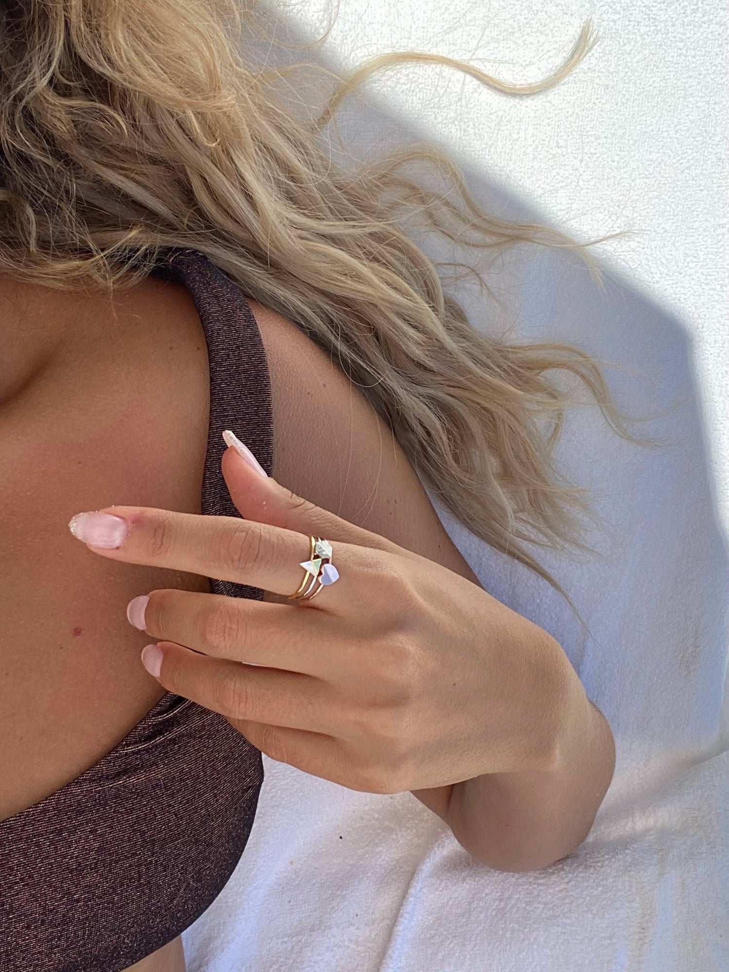 Blushed Heart Ring - white mother-of-pearl ring in rose gold vermeil by Nishi Pearls, styled on a model