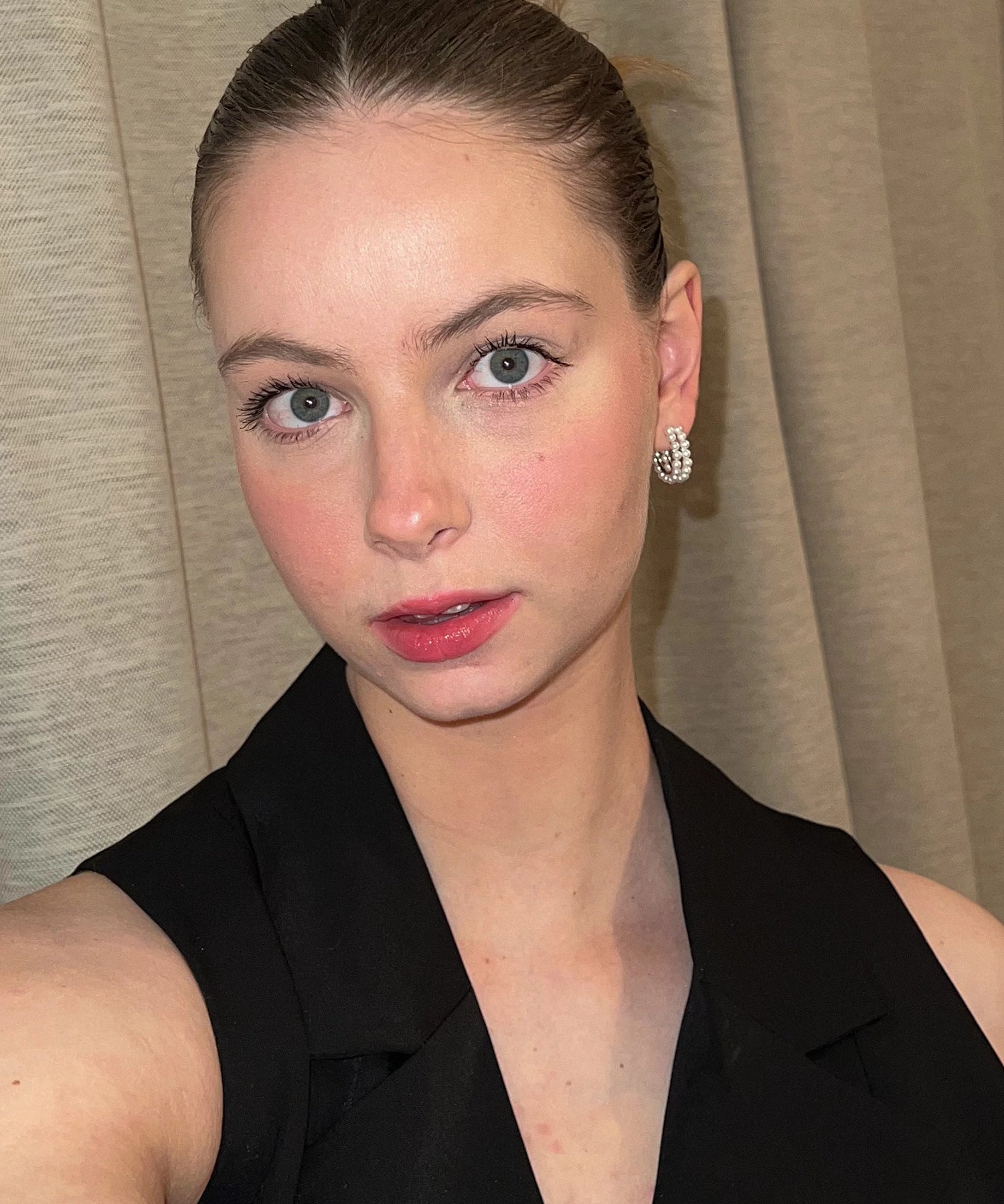 Celia Hoops - 3-4mm white round freshwater pearl earrings in sterling silver by Nishi Pearls, worn on a model