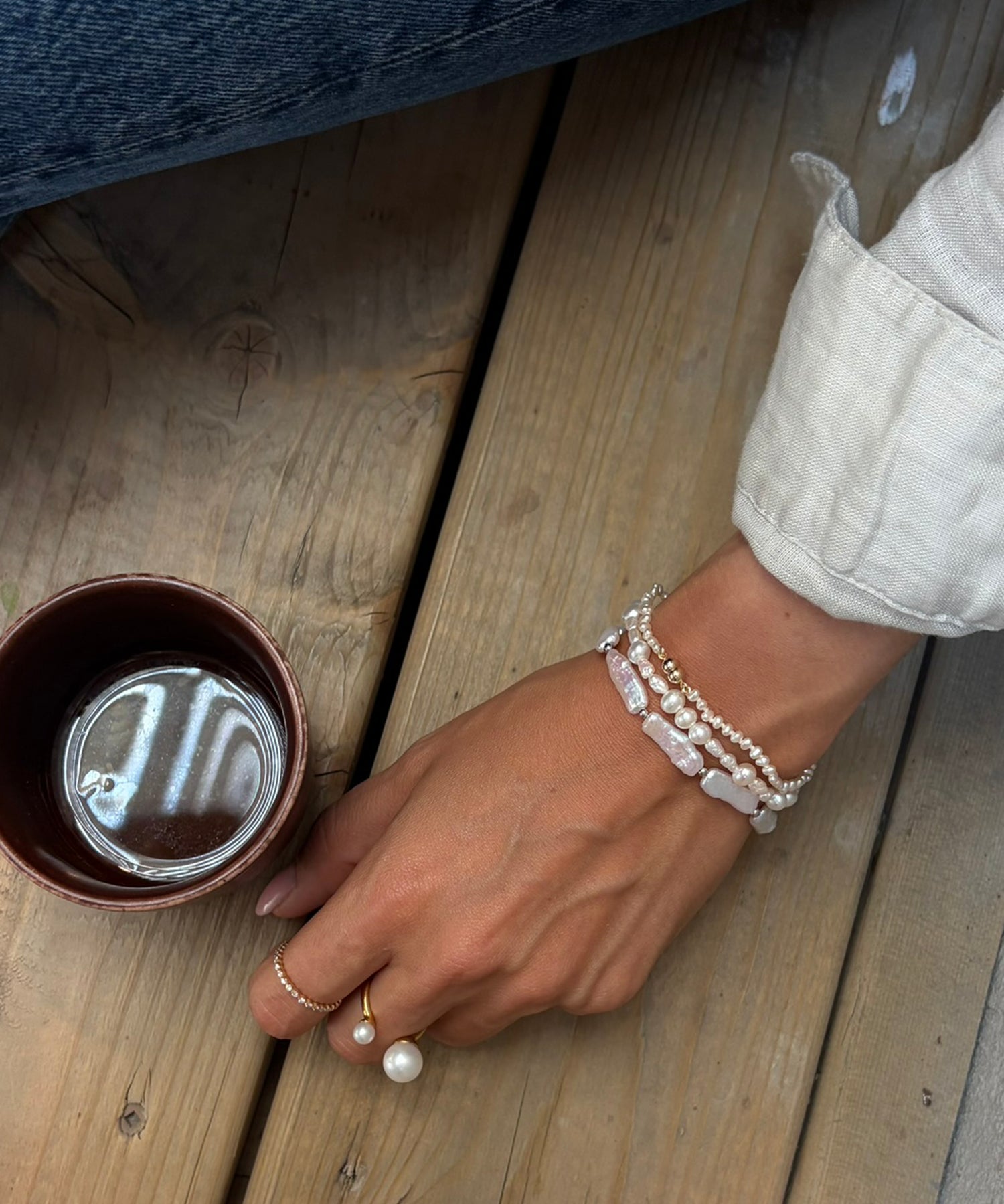 Ciel Bracelet - 6x18mm white freshwater pearl bracelet in sterling silver on elastic by Nishi Pearls, worn on a model