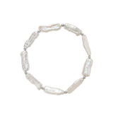 Ciel Bracelet - 6x18mm white freshwater pearl bracelet in sterling silver on elastic by Nishi Pearls, studio view