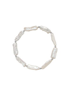 Ciel Bracelet - 6x18mm white freshwater pearl bracelet in sterling silver on elastic by Nishi Pearls, studio view
