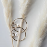 Cosmos Earring - 7-8mm white round freshwater pearl earrings in yellow gold vermeil by Nishi Pearls, styled lifestyle photo