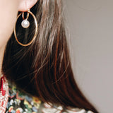 Cosmos Earring - 7-8mm white round freshwater pearl earrings in sterling silver by Nishi Pearls, worn on a model