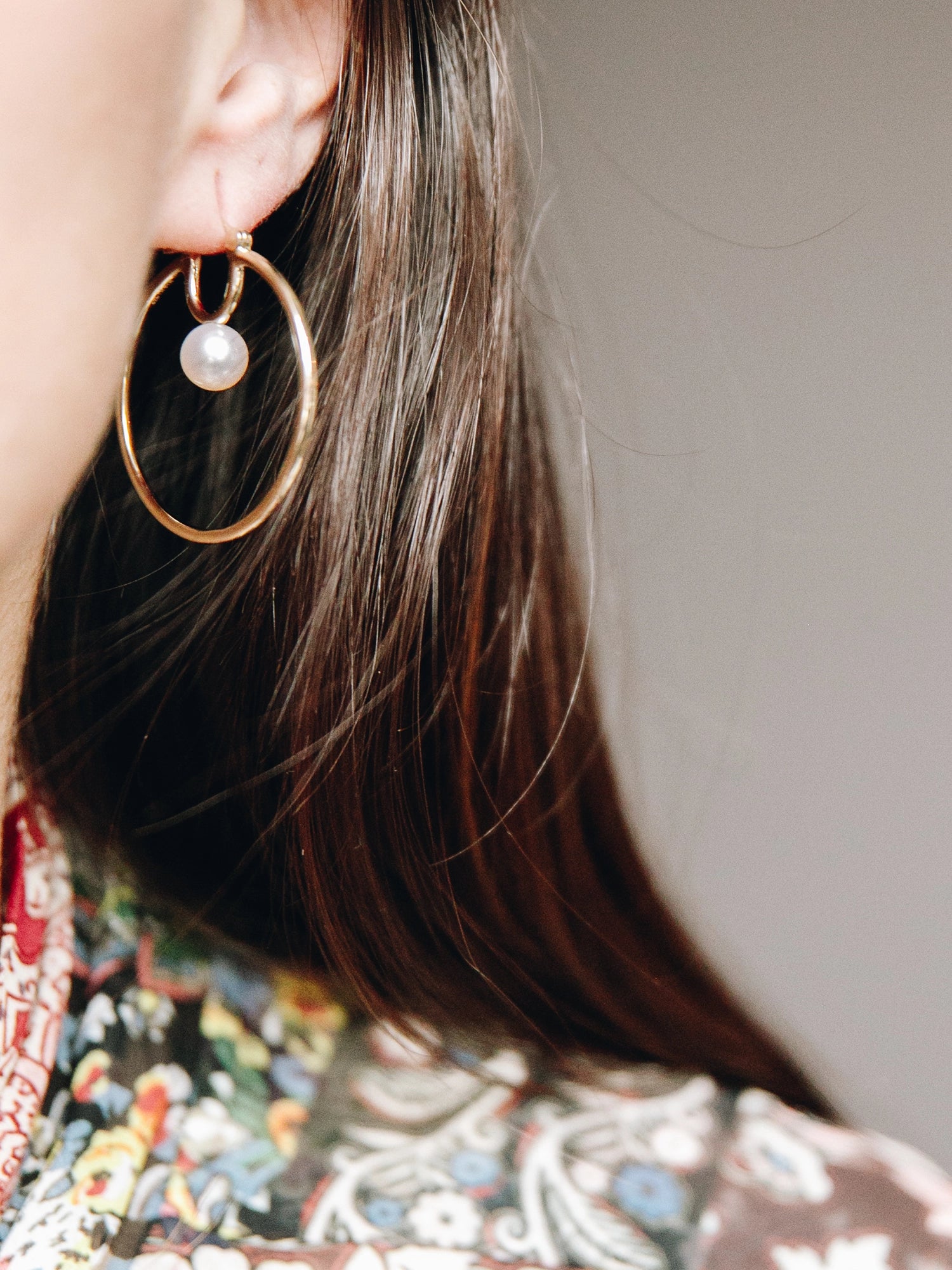 Cosmos Earring - 7-8mm white round freshwater pearl earrings in sterling silver by Nishi Pearls, worn on a model