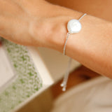 Daisy Bracelet - 14-15mm white baroque freshwater pearls in sterling silver, adjustable by Nishi Pearls, worn on a model