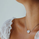 Daisy Necklace - 14-15mm white baroque freshwater pearls in sterling silver, 15-17in by Nishi Pearls, styled on a model