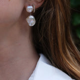 Daliah Earring - mixed-size white baroque freshwater pearl earrings in sterling silver by Nishi Pearls, styled on a model