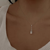 Deco Lux Necklace - 8-9mm white freshwater pearls in sterling silver with white topaz by Nishi Pearls, worn on a model