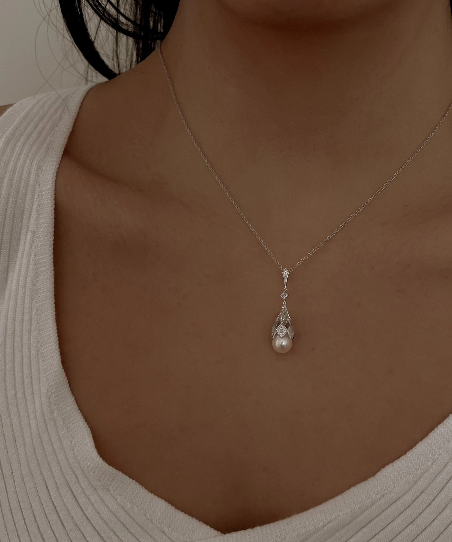Deco Lux Necklace - 8-9mm white freshwater pearls in sterling silver with white topaz by Nishi Pearls, worn on a model