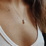 Diamond Mini Bar Necklace - 7-8mm white freshwater pearls in 10kt white gold, 18in by Nishi Pearls, worn on a model