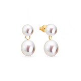 Drop Studs - mixed-size white freshwater pearl earrings in 14kt yellow gold by Nishi Pearls, studio view