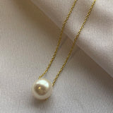 Gold Chain Necklace - 8-9mm white freshwater pearls in 14kt yellow gold, 16.5-18.5in by Nishi Pearls, styled lifestyle photo