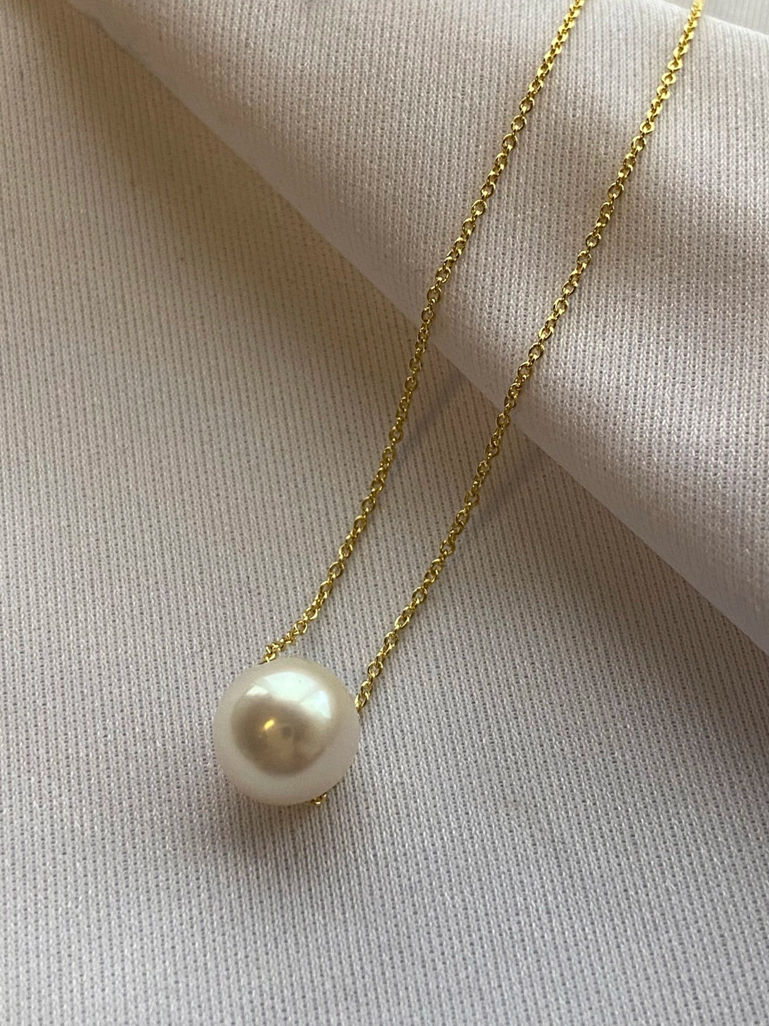 Gold Chain Necklace - 8-9mm white freshwater pearls in 14kt yellow gold, 16.5-18.5in by Nishi Pearls, styled lifestyle photo