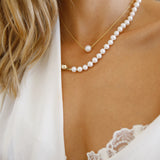 Gold Chain Necklace - 8-9mm white freshwater pearls in 14kt yellow gold, 16.5-18.5in by Nishi Pearls, worn on a model