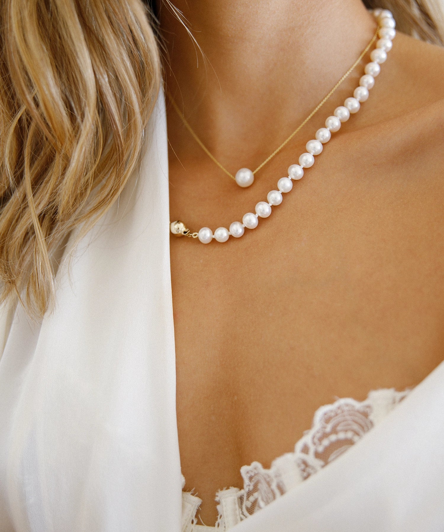 Gold Chain Necklace - 8-9mm white freshwater pearls in 14kt yellow gold, 16.5-18.5in by Nishi Pearls, worn on a model
