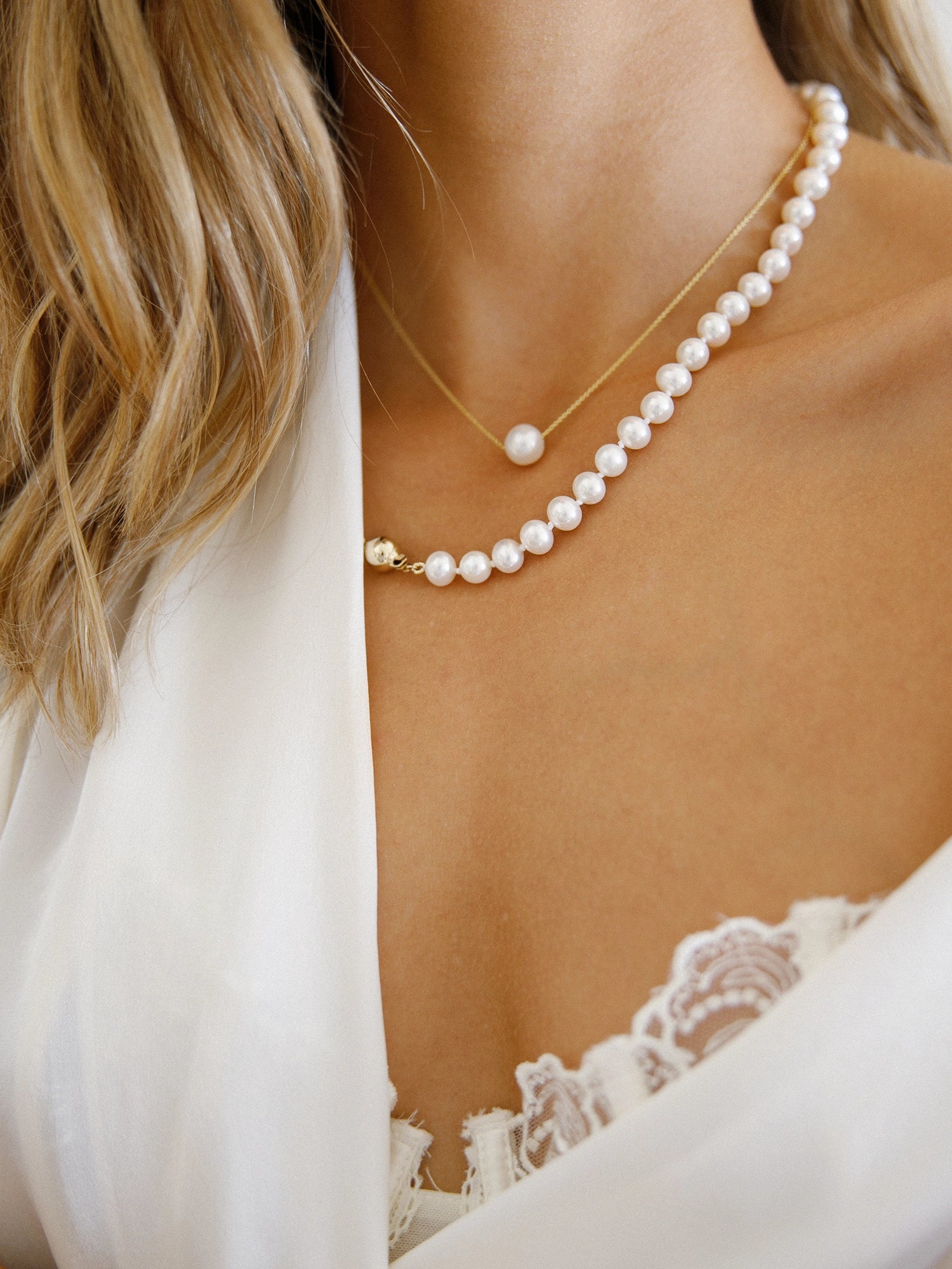 Gold Chain Necklace - 8-9mm white freshwater pearls in 14kt yellow gold, 16.5-18.5in by Nishi Pearls, worn on a model