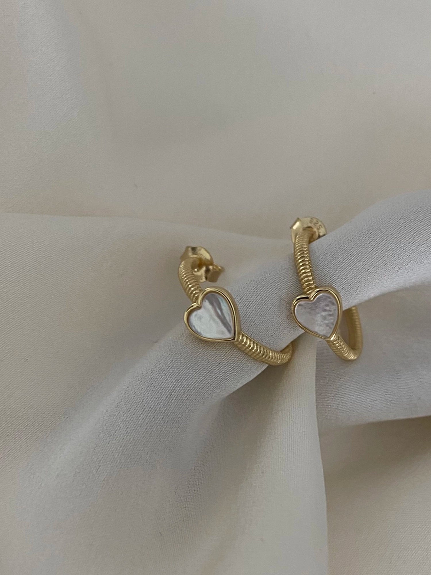 Hera Earring - white mother-of-pearl earrings in yellow gold vermeil by Nishi Pearls, styled lifestyle photo