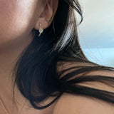 Hera Earring - white mother-of-pearl earrings in yellow gold vermeil by Nishi Pearls, worn on a model