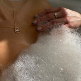 Hera Necklace - white mother-of-pearl necklace in yellow gold vermeil, 16-18.5in by Nishi Pearls, styled on a model