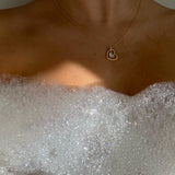 Hera Necklace - white mother-of-pearl necklace in yellow gold vermeil, 16-18.5in by Nishi Pearls, worn on a model