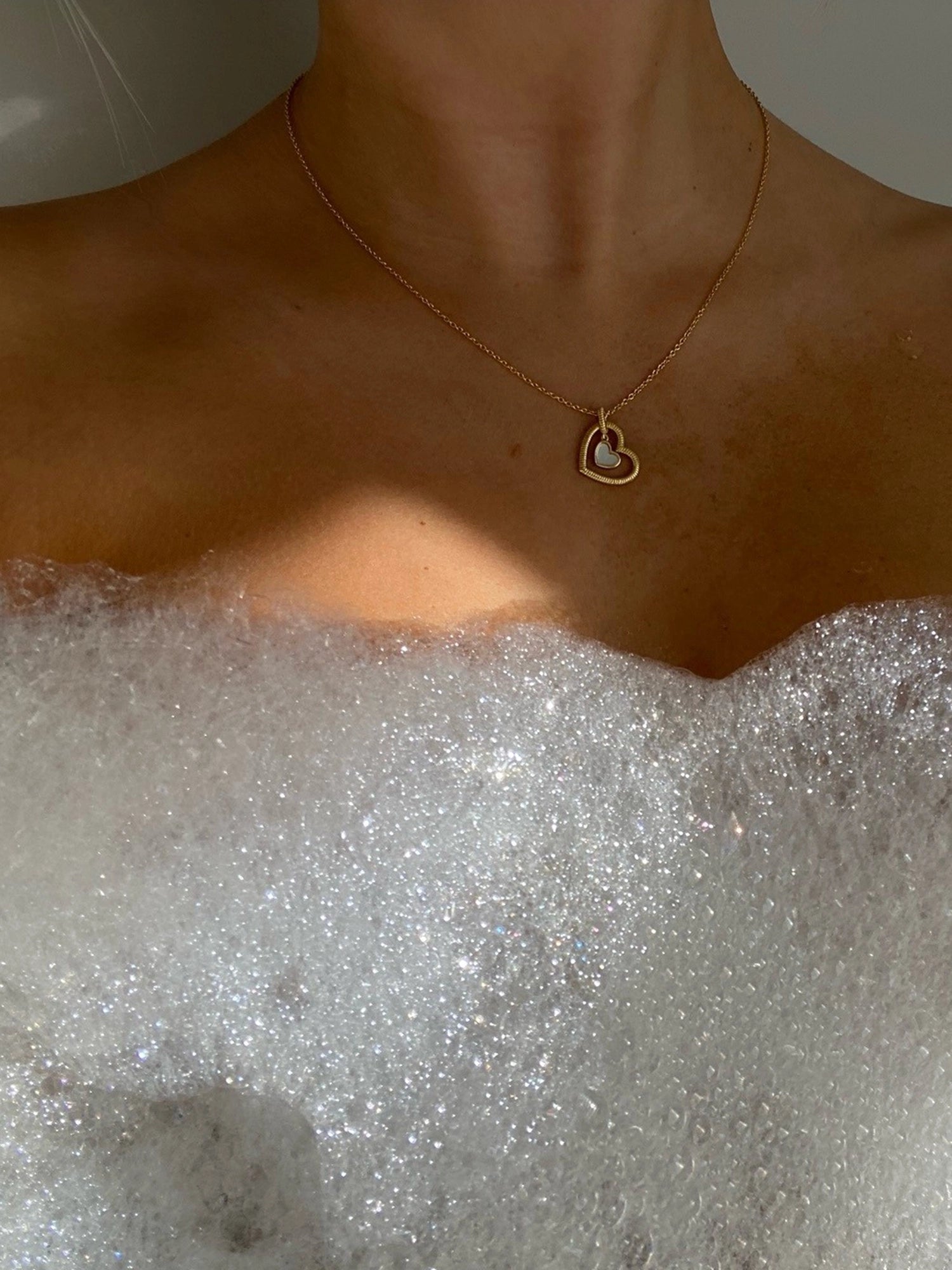 Hera Necklace - white mother-of-pearl necklace in yellow gold vermeil, 16-18.5in by Nishi Pearls, worn on a model