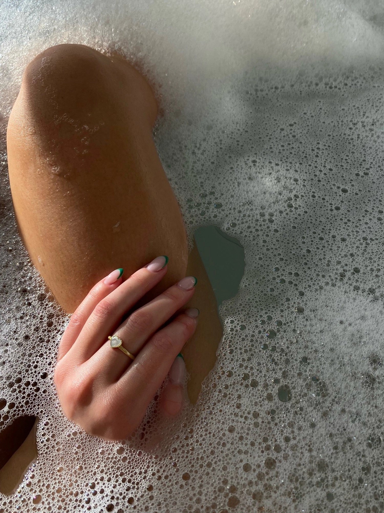 Hera Ring - white mother-of-pearl ring in yellow gold vermeil by Nishi Pearls, worn on a model