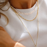 Holly Necklace - 16-17mm white baroque freshwater pearls in gold vermeil, 14-22in by Nishi Pearls, worn on a model