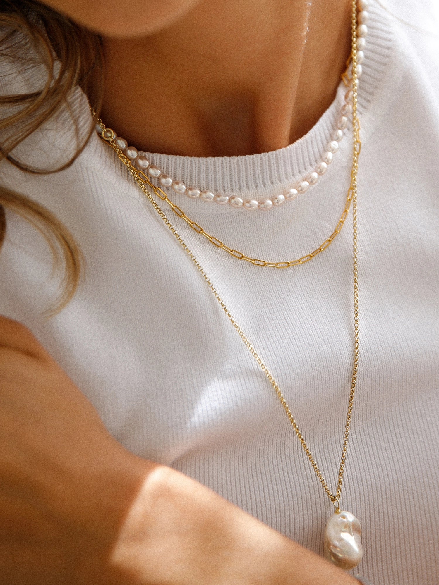 Holly Necklace - 16-17mm white baroque freshwater pearls in gold vermeil, 14-22in by Nishi Pearls, worn on a model