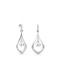 Larmee Earring - 6-7mm white round freshwater pearl earrings in sterling silver with topaz by Nishi Pearls, studio view