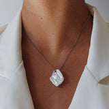 Lily Necklace - mixed-size white baroque freshwater pearls in sterling silver, 16-18in by Nishi Pearls, worn on a model